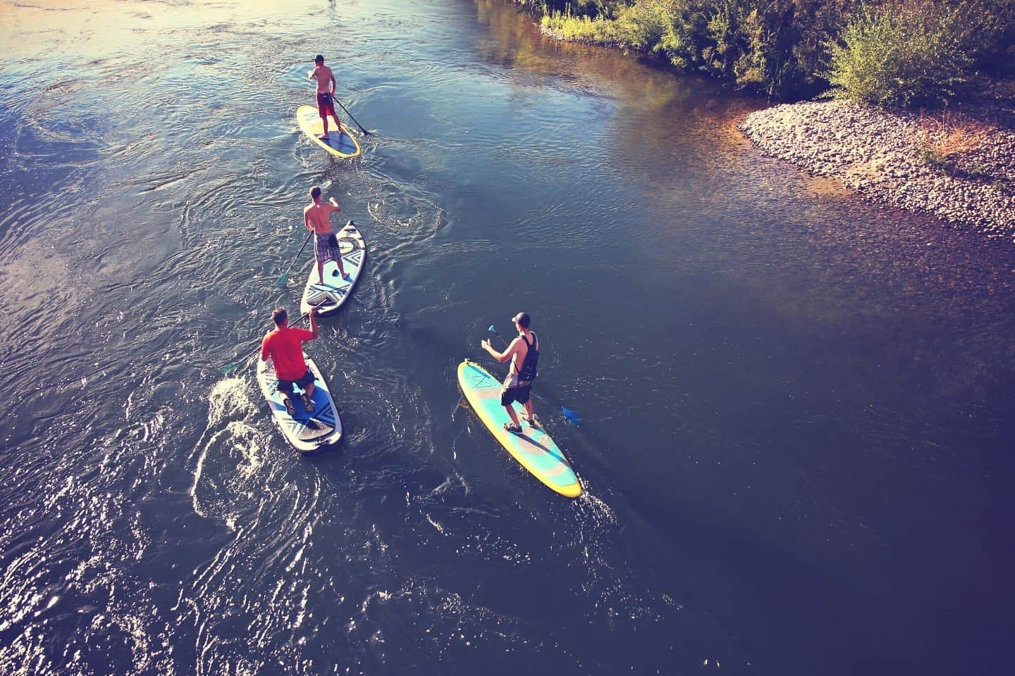 A group of man on paddle boarding adventure