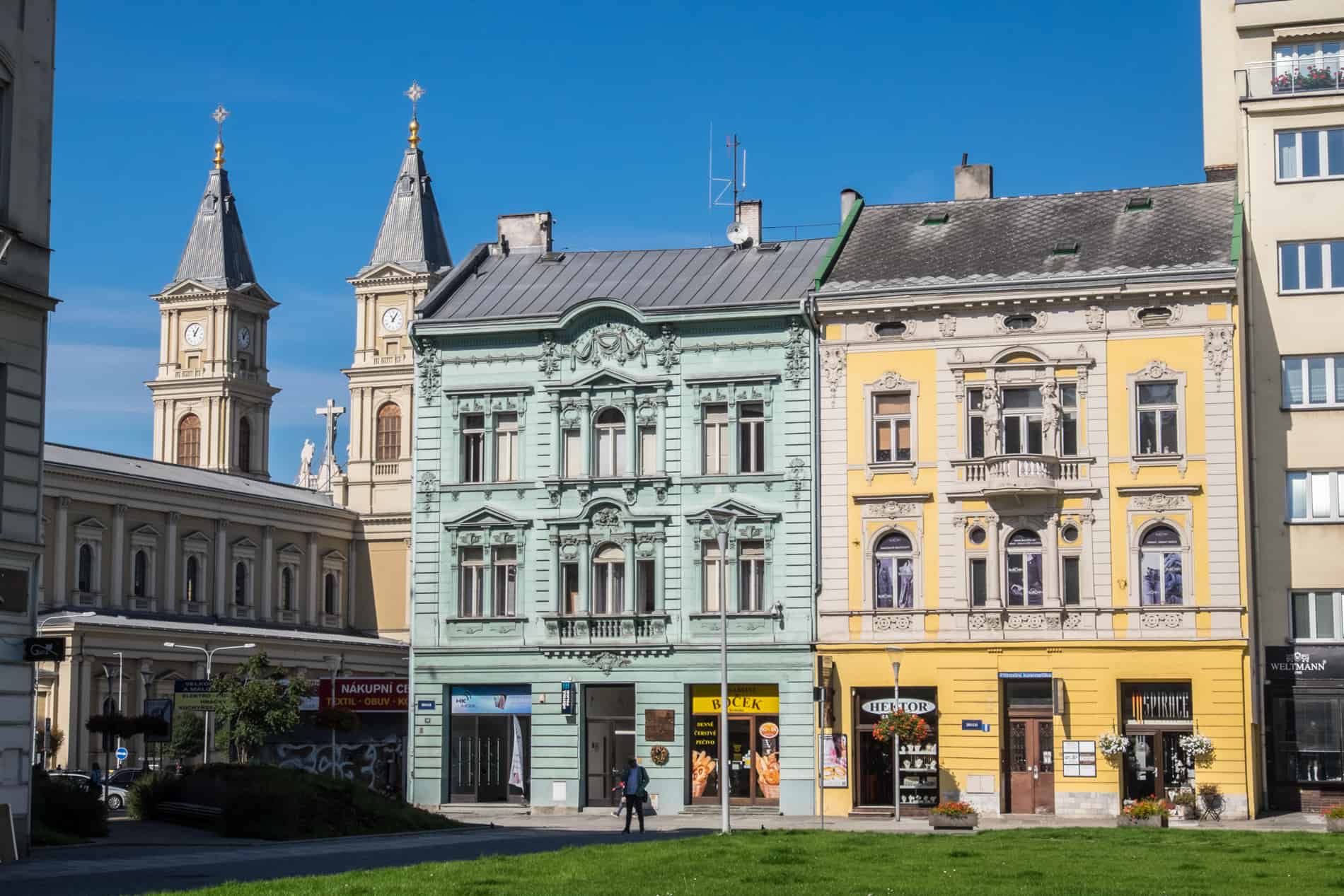 Mint green and yellow decorated buildings in Ostrava city. 