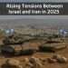 Two tanks with Israeli flags overlooking a cityscape, symbolizing heightened military alertness in response to growing tensions with Iran in 2025.