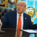 Trump Speaks as Senate Debates Landmark Tax Reform and Budget Cuts Bill Live on Air 4 Former President Donald Trump speaks energetically at the Oval Office desk during a live policy discussion, with U.S. and Space Force flags in the background and a binder open in front of him.