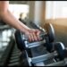 Healthy Lifestyle in 2025: Daily Habits to Boost Mind & Body 2 Close-up of a person lifting a dumbbell in a modern gym, emphasizing strength training and fitness