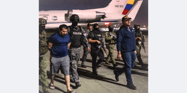 Ecuadorian police escort drug lord Fito during extradition to the United States after his prison escape, night operation near military jet"
