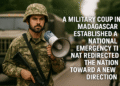 Madagascar Military Coup Sparks New National Era 12 Soldier near Madagascar flag in Antananarivo with military vehicles and onlookers during 2025 coup, wide 16:9 scene, calm but tense atmosphere.